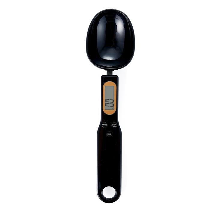 Sleek black electronic food weighing spoon close up shot