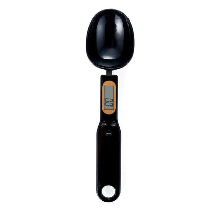 Sleek black electronic food weighing spoon close up shot