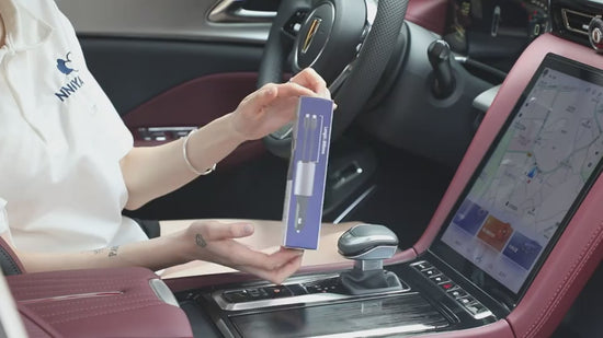 Dual retractable Apple Lightning and Type-C cables extending from a fast car charger